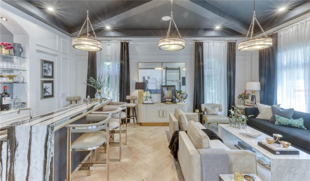 4923 West San Rafael Street Tampa, FL 33629 - Photo 17 of 70 a living room with furniture and a large mirror