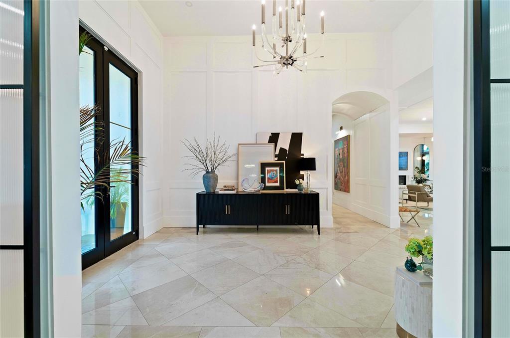 4923 West San Rafael Street Tampa, FL 33629 - Photo 20 of 70 a living room with furniture and a chandelier