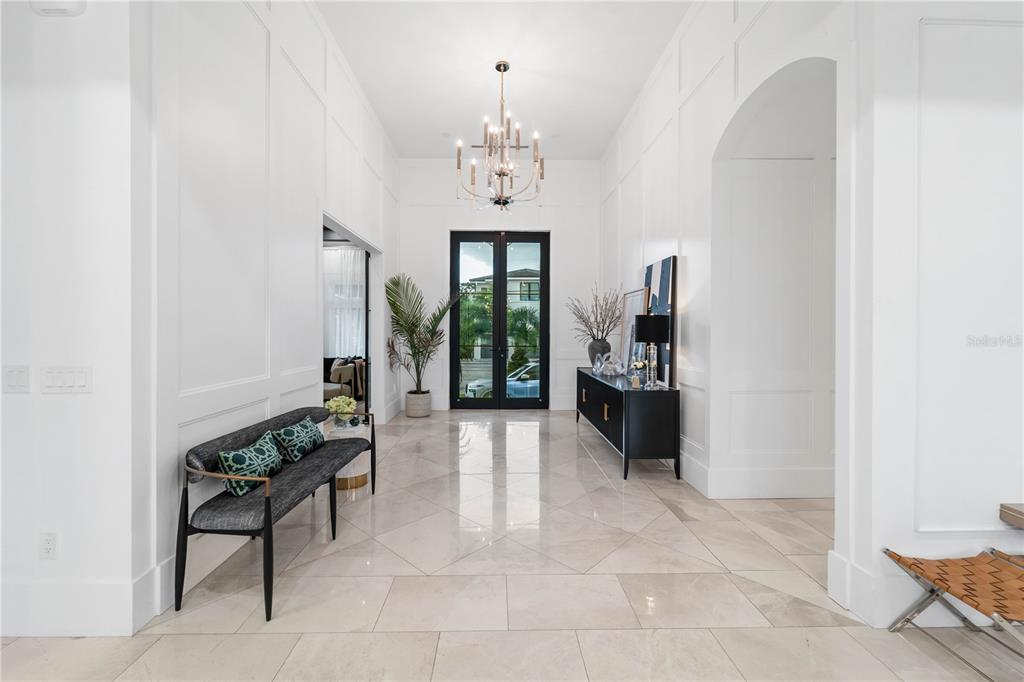 4923 West San Rafael Street Tampa, FL 33629 - Photo 21 of 70 a living room with furniture and a chandelier