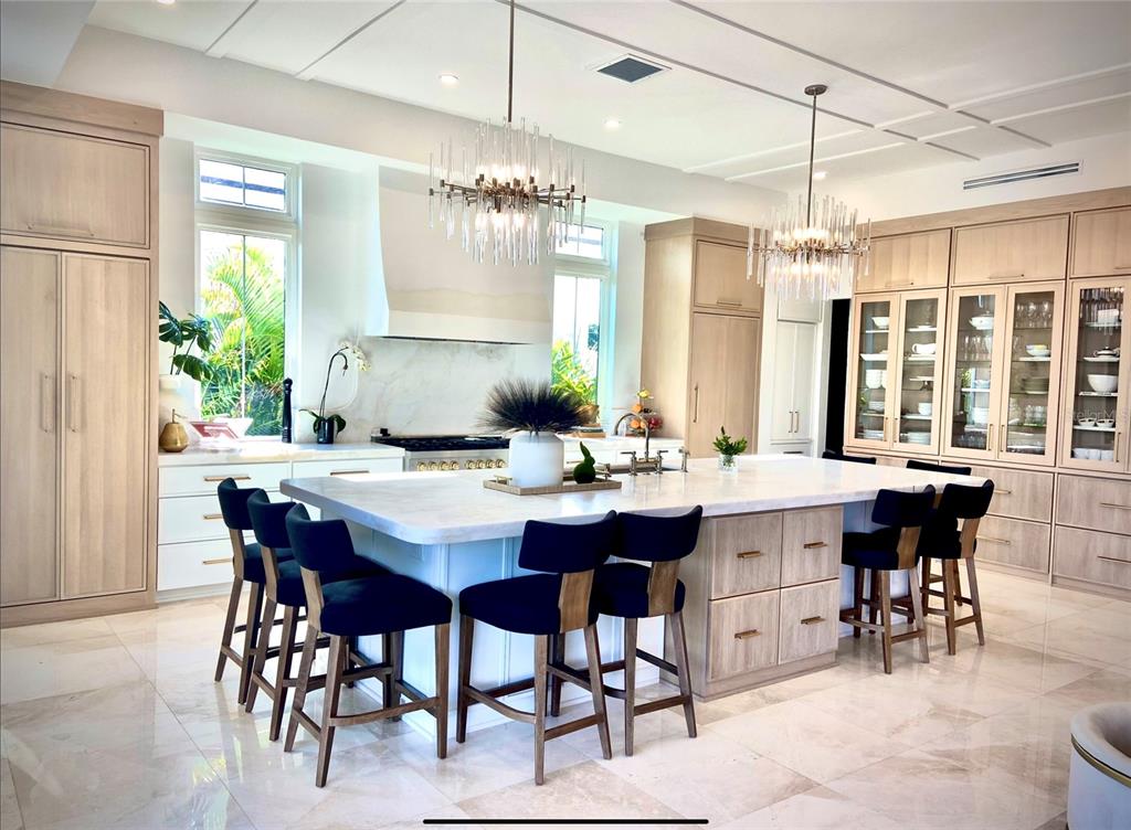 4923 West San Rafael Street Tampa, FL 33629 - Photo 25 of 70 a dining room with a table chairs and a chandelier