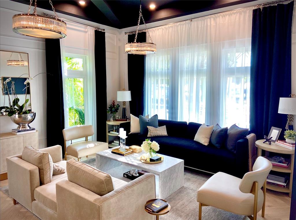 4923 West San Rafael Street Tampa, FL 33629 - Photo 32 of 70 a living room with furniture and large windows