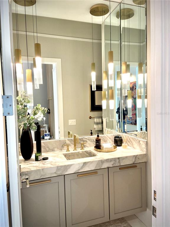 4923 West San Rafael Street Tampa, FL 33629 - Photo 34 of 70 a bathroom with a sink and a mirror