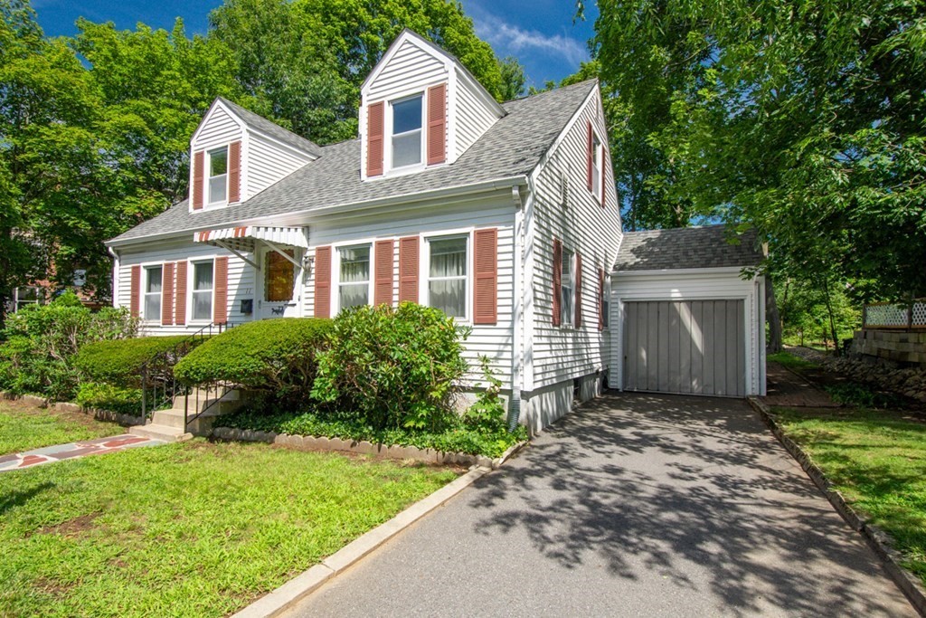 11 Stimson Street Boston, MA 02132 - Photo 1 of 32 a front view of a house with a yard and garage