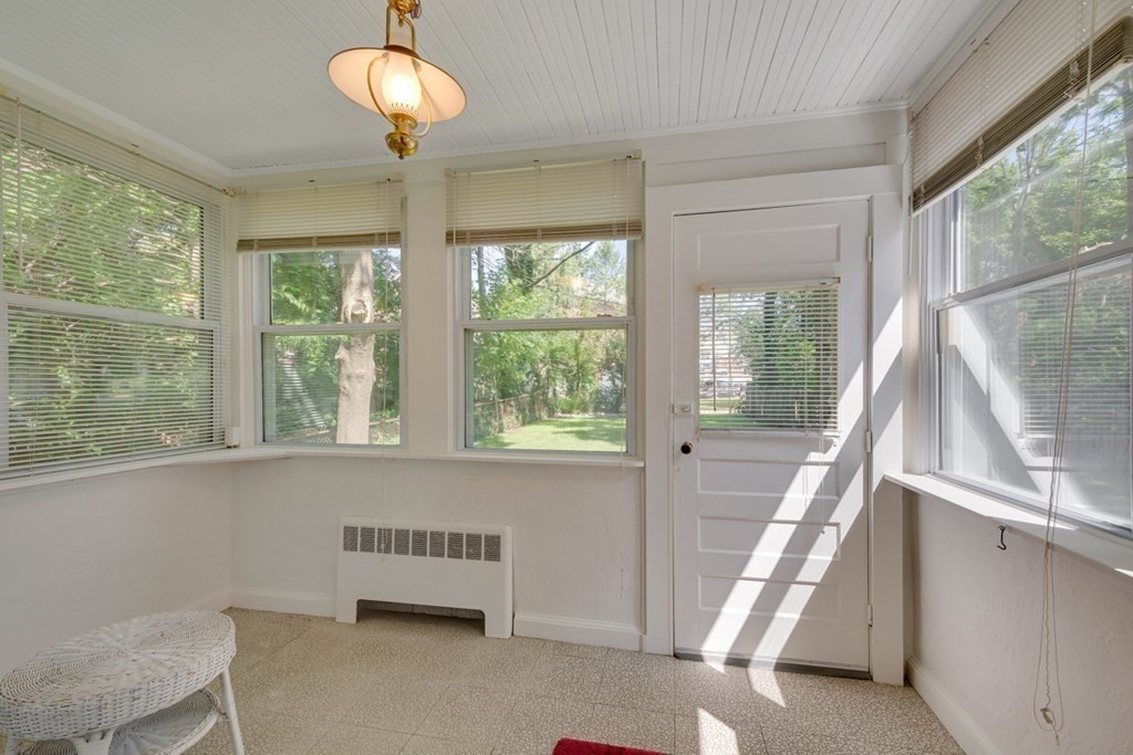 11 Stimson Street Boston, MA 02132 - Photo 14 of 32 a bedroom with furniture and a large window