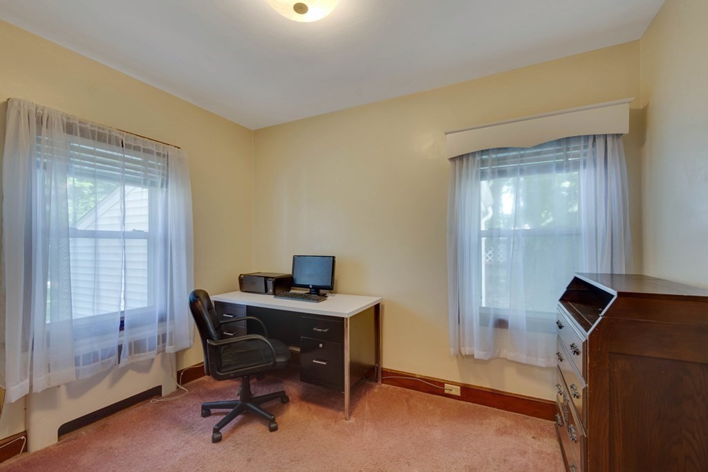 11 Stimson Street Boston, MA 02132 - Photo 17 of 32 a view of a workspace with furniture and a window