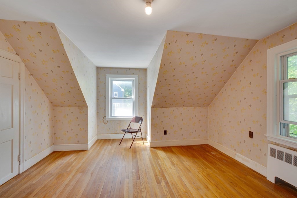 11 Stimson Street Boston, MA 02132 - Photo 21 of 32 wooden floor in an empty room with a window