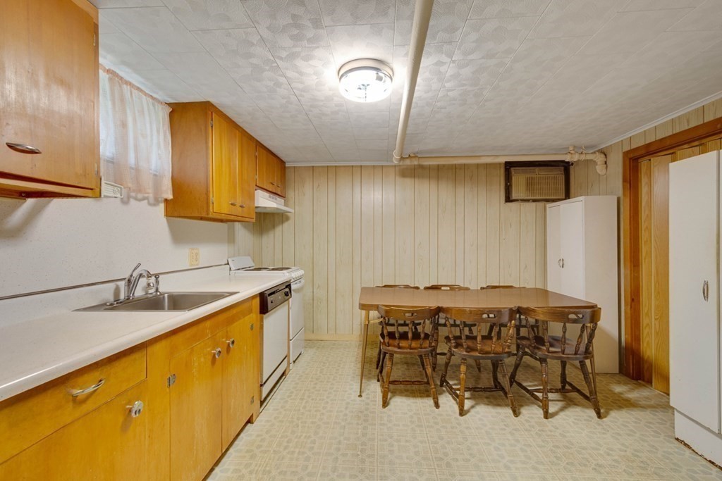 11 Stimson Street Boston, MA 02132 - Photo 26 of 32 a kitchen with a sink cabinets and appliances