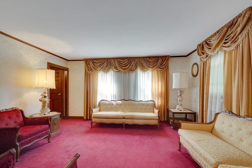 11 Stimson Street Boston, MA 02132 - Photo 7 of 32 a spacious bedroom with a bed and a couch