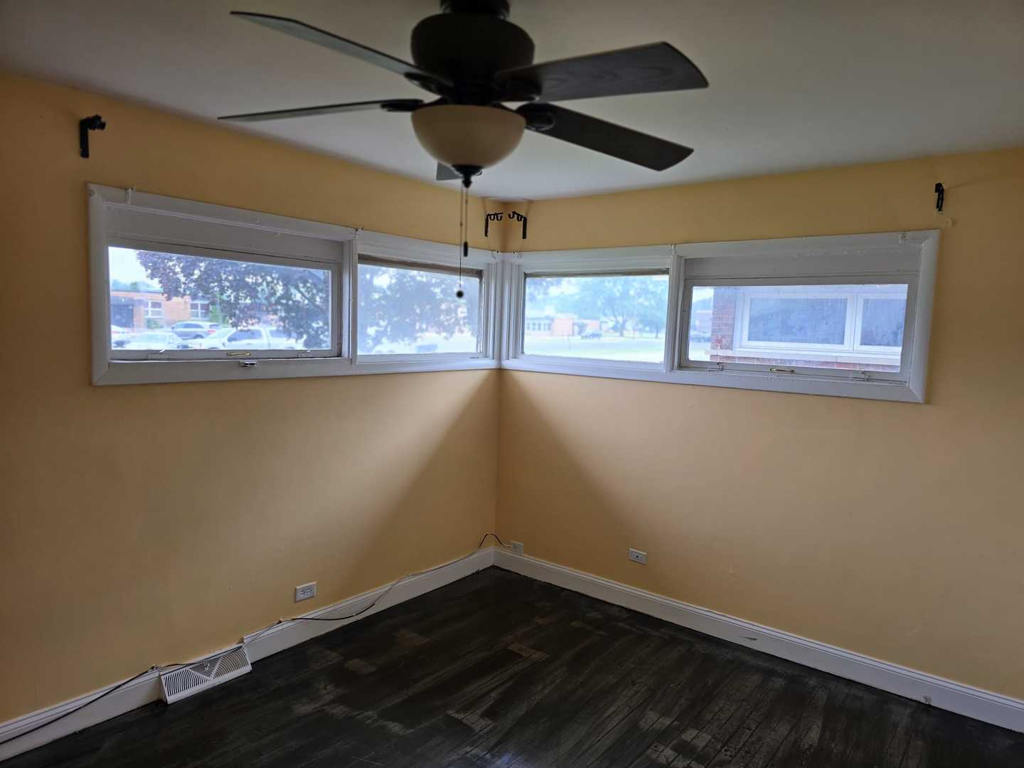 3014 West 163rd Street Markham, IL 60428 - Photo 14 of 18 a view of empty room with wooden floor and fan