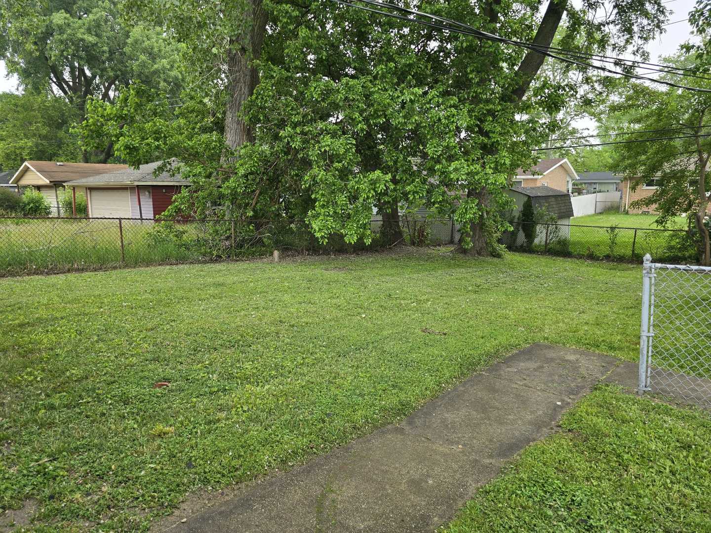 3014 West 163rd Street Markham, IL 60428 - Photo 17 of 18 a view of a house with a backyard