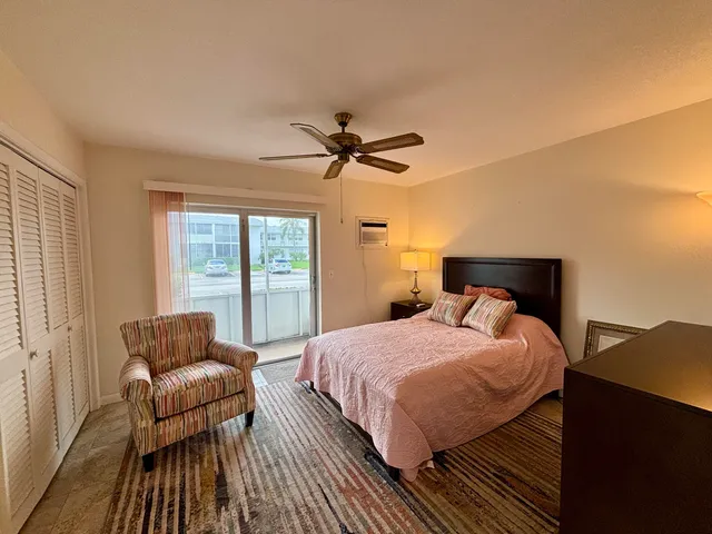 a bedroom with a bed and a mirror