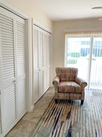 a room with wooden floor and furniture