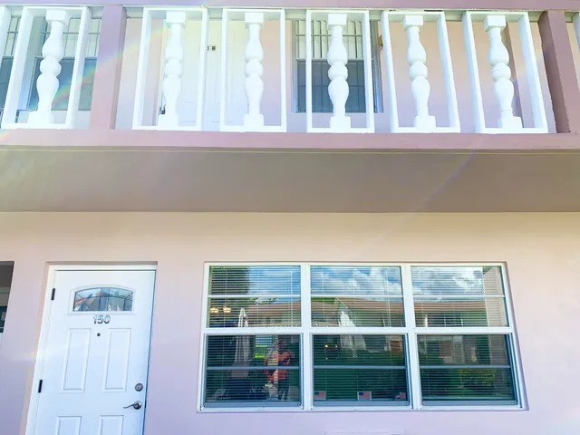 a view of wooden floor and a window