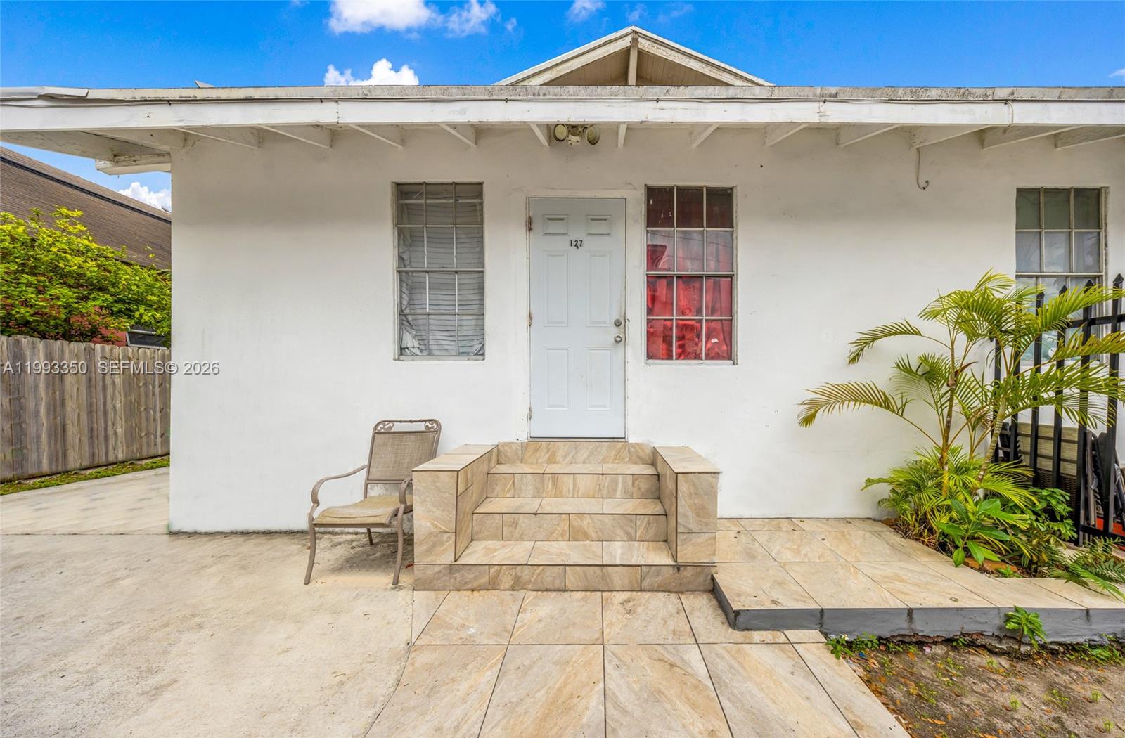127 Southwest 7th Avenue Miami, FL 33130 - Photo 2 of 6 a front view of a house with chairs