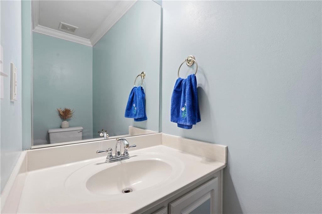 2664 Reston Court Northwest Kennesaw, GA 30144 - Photo 12 of 28 a bathroom with a sink vanity and a mirror