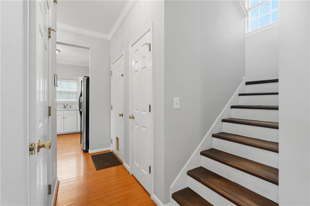 2664 Reston Court Northwest Kennesaw, GA 30144 - Photo 13 of 28 a view of a hallway with wooden floor and entryway