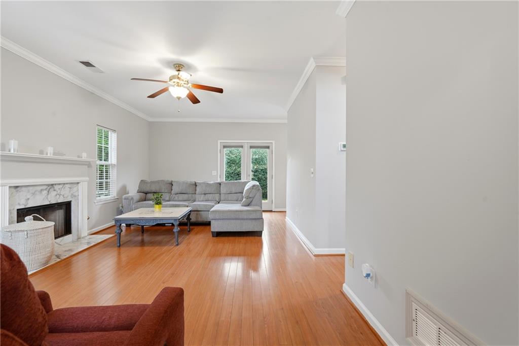 2664 Reston Court Northwest Kennesaw, GA 30144 - Photo 6 of 28 a living room with furniture or fireplace and a wooden floor