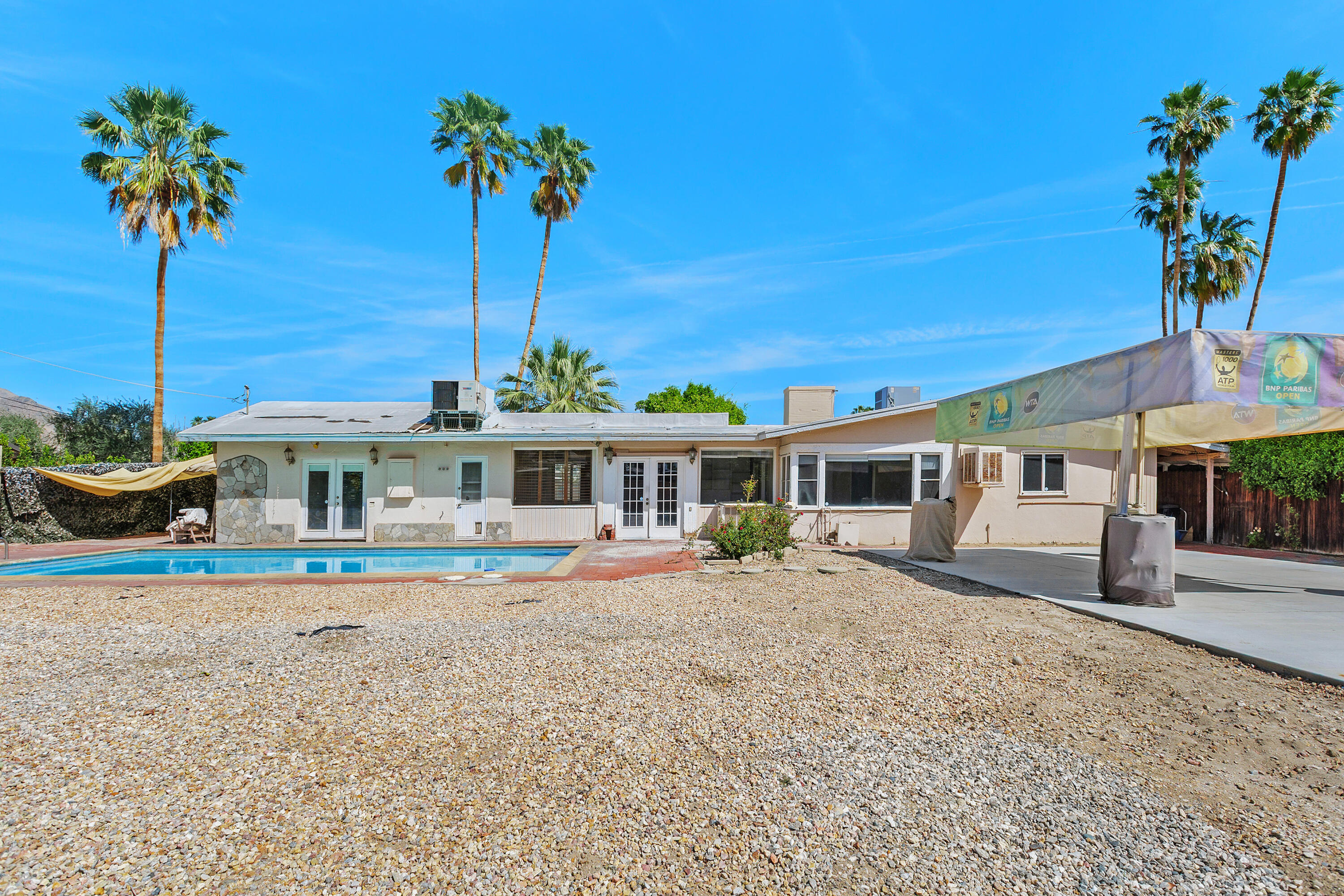 1077 South Riverside Drive Palm Springs, CA 92264 - Photo 34 of 35 a front view of a house with garden