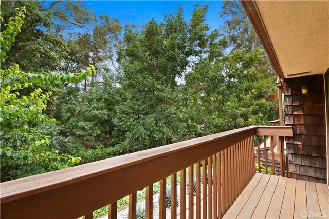 a view of balcony with wooden floor