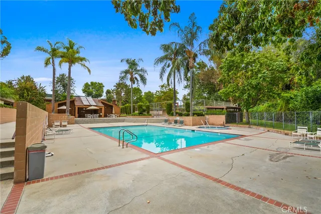 a view of a swimming pool with a patio