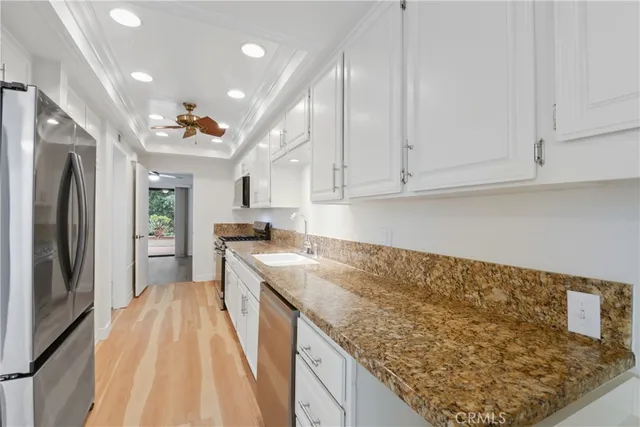 a kitchen with a sink stove and refrigerator
