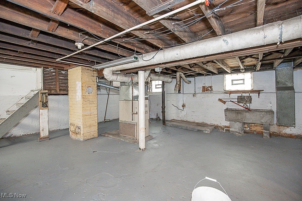 3538 Independence Road Cleveland, OH 44105 - Photo 21 of 24 Basement featuring heating unit and stairway