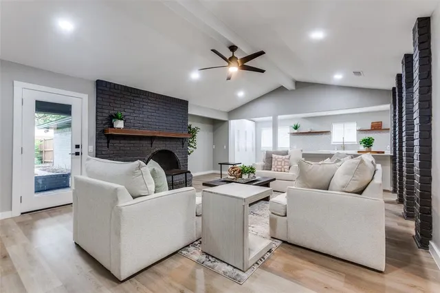 a living room with furniture and a fireplace