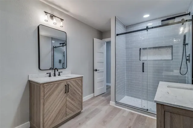 a view of an empty room and wooden floor