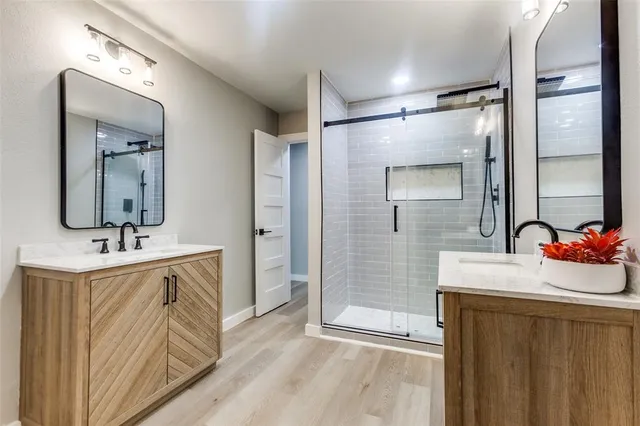 a bathroom with a sink a mirror and vanity