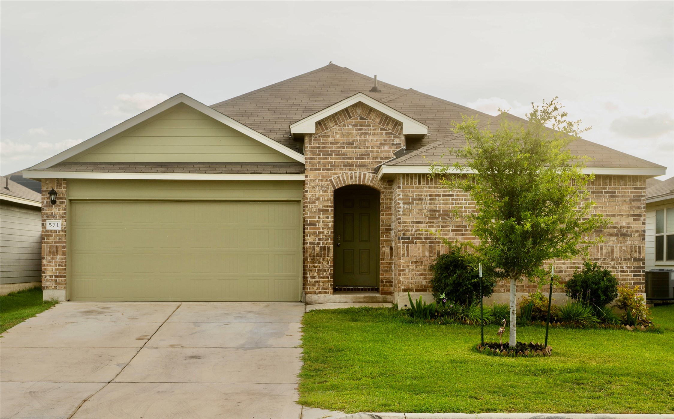 a front view of a house with a yard