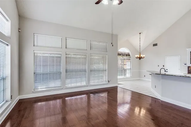a kitchen with stainless steel appliances a sink stove and cabinets