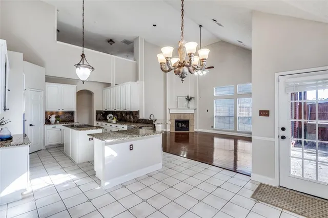 a kitchen with a sink counter top space cabinets and stainless steel appliances