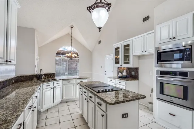 a kitchen with a stove and a refrigerator