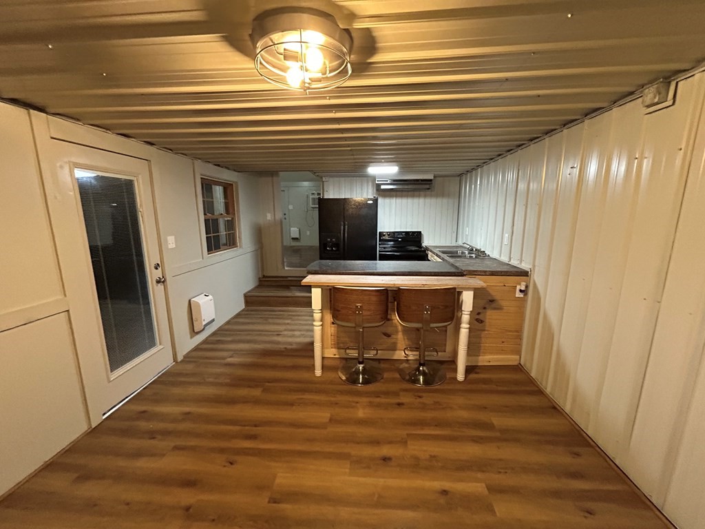 130 Clement Street Big Sandy, TN 38221 - Photo 11 of 17 a view of a room with wooden floor