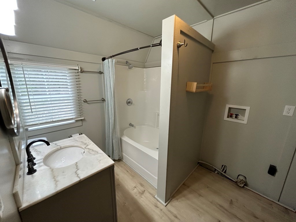 130 Clement Street Big Sandy, TN 38221 - Photo 6 of 17 a bathroom with a sink and shower
