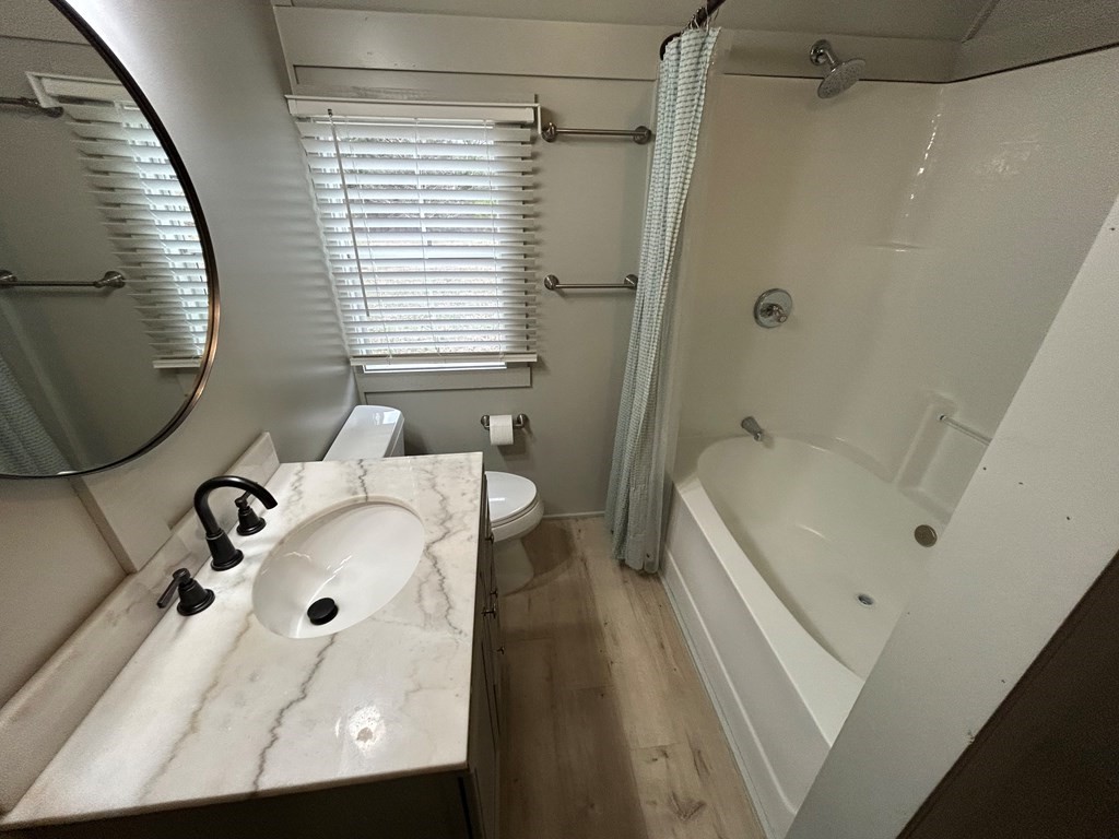 130 Clement Street Big Sandy, TN 38221 - Photo 7 of 17 a bathroom with a sink and a mirror