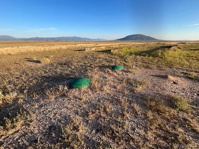 a view of an ocean from a mountain