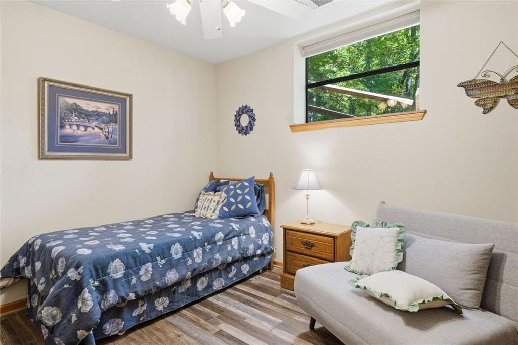 251 Panorama Point Jasper, GA 30143 - Photo 40 of 93 a bedroom with a bed and wooden floor
