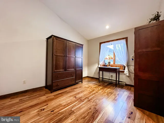 a view of a livingroom with furniture and wooden floor