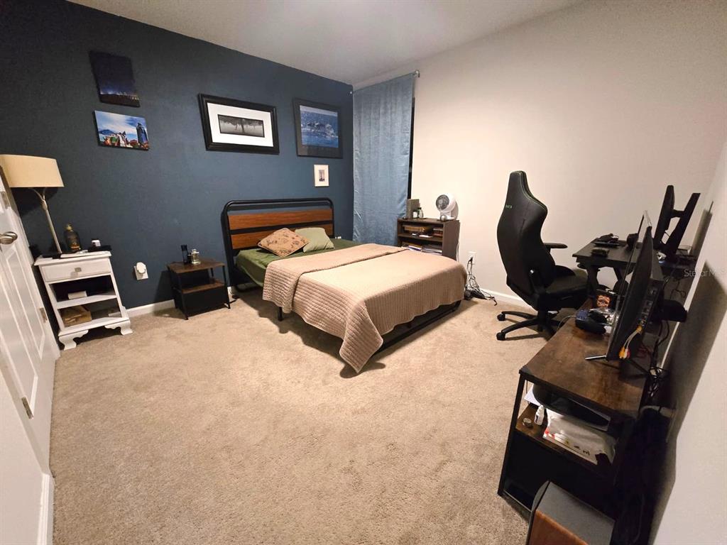 10682 Old Sycamore Loop Land O Lakes, FL 34638 - Photo 18 of 22 a bedroom with bed and window