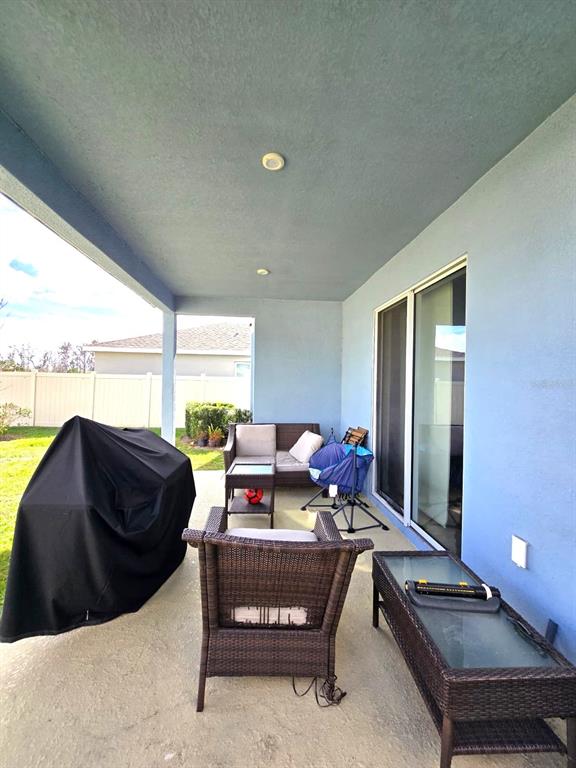10682 Old Sycamore Loop Land O Lakes, FL 34638 - Photo 20 of 22 a living room with furniture and a window