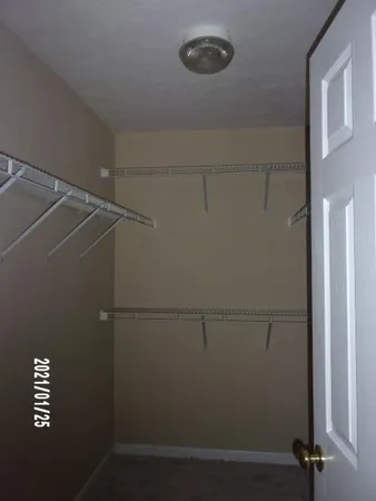 a view of a room with racks on the wall