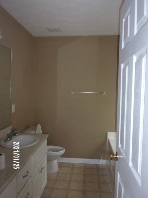 1812 Cumbaa Court Columbus, GA 31907 - Photo 19 of 30 a bathroom with a granite countertop toilet and a sink