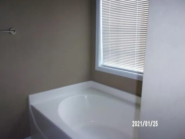 a white bath tub sitting in a bathroom