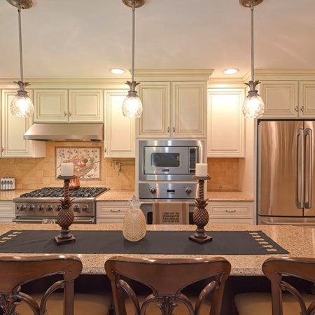 48 Devol Pond Drive Westport, MA 02790 - Photo 11 of 39 a kitchen with a table chairs stove and kitchen view