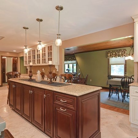 48 Devol Pond Drive Westport, MA 02790 - Photo 12 of 39 a kitchen with kitchen island granite countertop a sink a stove and a wooden floors