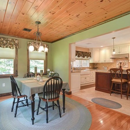 48 Devol Pond Drive Westport, MA 02790 - Photo 14 of 39 a view of a dining room with furniture window and wooden floor