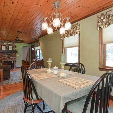48 Devol Pond Drive Westport, MA 02790 - Photo 15 of 39 a view of a dining room with furniture and wooden floor