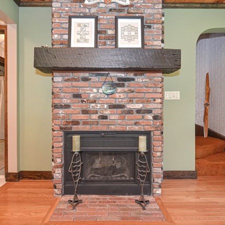48 Devol Pond Drive Westport, MA 02790 - Photo 16 of 39 a close view of a fireplace in wooden floor