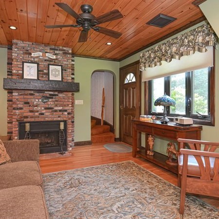 48 Devol Pond Drive Westport, MA 02790 - Photo 18 of 39 a living room with a couch a dining table and chairs